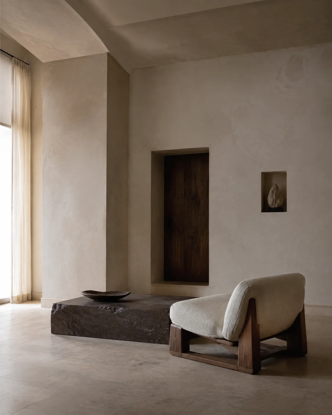 A quiet architectural room with sculptural furniture